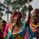 Vibrant cultural performance in Rwanda featuring traditional clothing and singing.